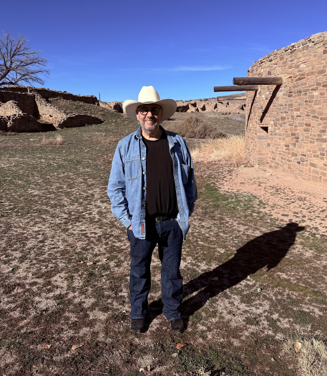Dino Doug standing in an open desert landscape